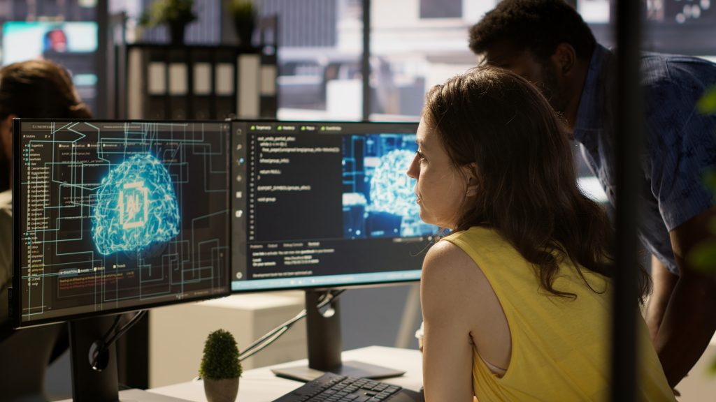 Image showing professionals working on programming and data visualization using AI, visualization example From Big Data to Artificial Intelligence: the role of AI in data analysis.